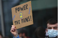 A Tottenham fan takes part in a protest against the Board over the planned creation of a European Super League, outside the Tottenham Hotspur Stadium ahead of the English Premier League football match between Tottenham Hotspur and Southampton in London, England, Wednesday April 21, 2021. (Clive Rose/Pool via AP)