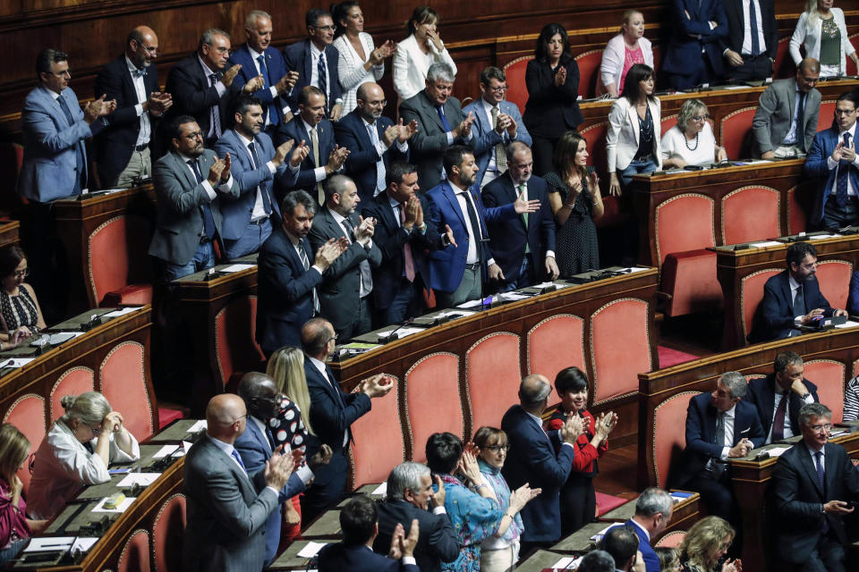 Italian Interior Minister and Deputy-Premier Matteo Salvini opens his arms as he addresses the Senate in Rome, Tuesday, Aug. 13, 2019. Italy’s political leaders were scrambling to line up allies and alliances Tuesday as Matteo Salvini pressed his demands for early elections as soon as possible in the hope of snagging the premiership with his anti-migrant, Euro-skeptic agenda. Hastily summoned back from a vacation break, the Senate was convened to vote later Tuesday on when to schedule a no-confidence motion lodged by Salvini’s right-wing League party against Premier Giuseppe Conte’s 14-month old populist government. (Giuseppe Lami/ANSA via AP)
