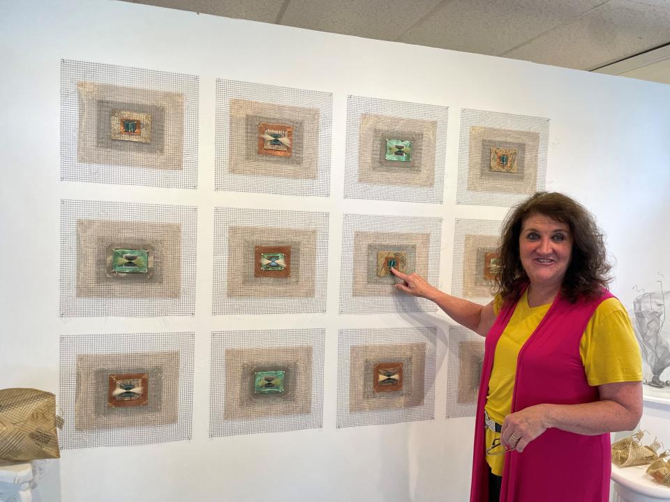 Textile artist Anne Kenny showcases her "Industrial Quilts," which are influenced by the Industrial Revolution, the Mill Girls, and technology at the gallery at Art Up Front Street.