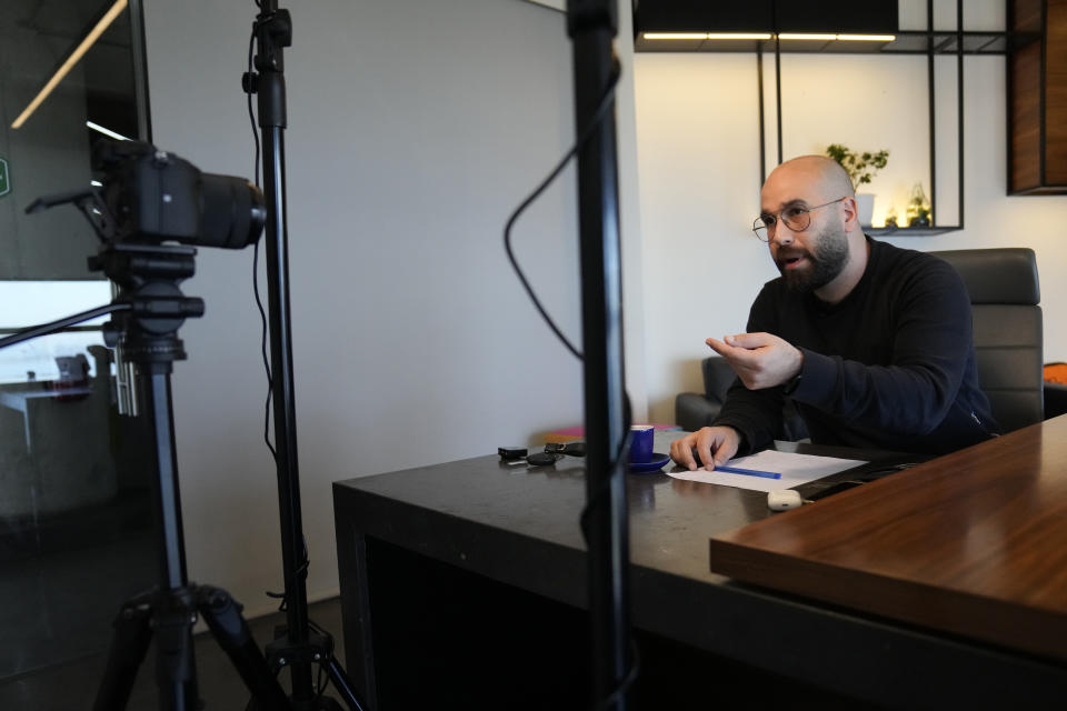 Jad Ghosn, a journalist who recently decided to run in upcoming parliamentary elections with the leftist group Citizens in a State, records a video for social media, in Jounieh, north of Beirut, Lebanon, April 14, 2022. The May 15 nationwide vote is the first since Lebanon's economy took a nosedive and an August 2020 explosion at Beirut's port killed more than 200 and destroyed parts of the capital. Lebanon's various disasters have fueled anger at Lebanon's political elite, but few see any hope that elections will dislodge them. (AP Photo/Hussein Malla)