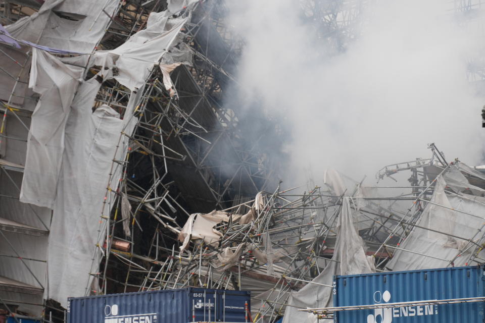 The ruins is seen after the outer wall has collapsed in a fire in the historical building Boersen, the former Stock Exchange in Copenhagen, Denmark, Friday April 19, 2024. Copenhagen's mayor said Thursday she contacted her Paris counterpart to see what could be learned from the reconstruction of the Notre Dame cathedral in the French capital, after a fire devastated the Danish city's 400-year-old stock exchange building. (Emil Helms/Ritzau Scanpix via AP)