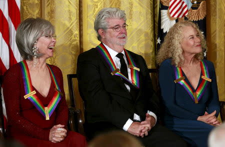 Kennedy Center Honorees (L-R) Rita Moreno, George Lucas and Carole King attend a reception at the White House in Washington December 6, 2015. REUTERS/Yuri Gripas