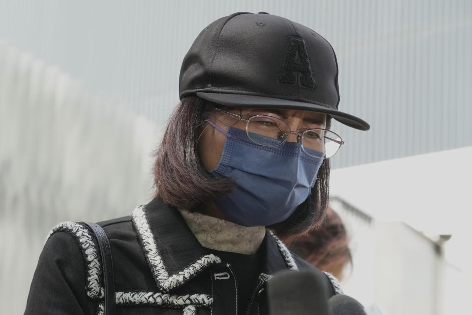 Mrs. Poon, the mother of a young woman killed in Taiwan, speaks to the media outside the government headquarters in Hong Kong, Wednesday, Oct. 20, 2021. Mrs. Poon, whose daughter Poon Hiu-wing was killed while visiting Taiwan in 2018, has lambasted Hong Kong authorities for letting suspect Chan Tong-kai walk free, instead of sending him to Taiwan to turn himself in. (AP Photo/Kin Cheung)