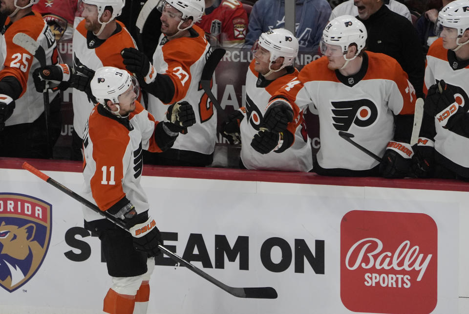 Philadelphia Flyers right wing Travis Konecny (11) celebrates his goal with his teammates during the second period of an NHL hockey game against the Florida Panthers, Tuesday, Feb. 6, 2024, in Sunrise, Fla. (AP Photo/Marta Lavandier)