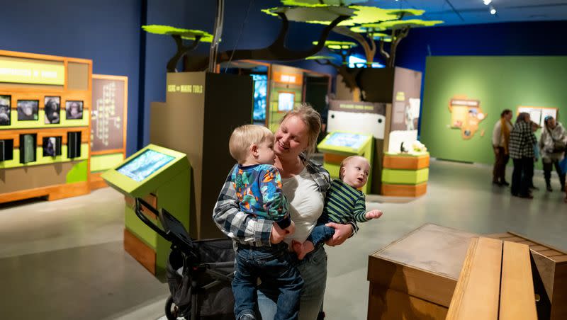 Amanda LaFrance and her children Danny, 2, and Asher, 11 months, tour the new exhibit “Becoming Jane: The Evolution of Dr. Jane Goodall” at the Natural History Museum of Utah in Salt Lake City on Saturday, Dec. 9, 2023.