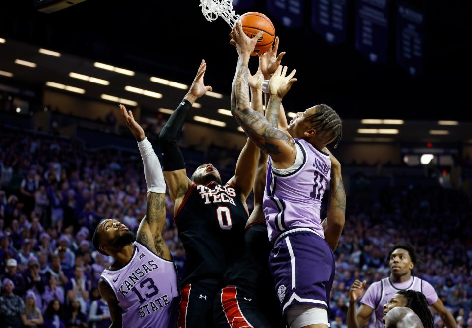 Texas Tech forward Kevin Obanor (0) is unable to score as Kansas State forward Keyontae Johnson (11) grabs the rebound while Kansas State's Desi Sills (13) also defends during the first half of an NCAA college basketball game on Saturday, Jan. 21, 2023, in Manhattan, Kan. (AP Photo/Colin E. Braley)