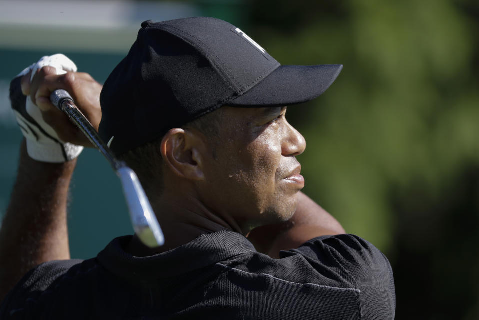 Tiger Woods watches his tee shot on the 14th hole during a practice round for the Memorial golf tournament, Tuesday, July 14, 2020, in Dublin, Ohio. (AP Photo/Darron Cummings)