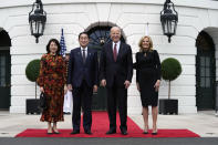 President Joe Biden and first lady Jill Biden greet Japanese Prime Minister Fumio Kishida and his wife Yuko Kishida upon their arrival at the White House, Tuesday, April 9, 2024, in Washington. (AP Photo/Susan Walsh)