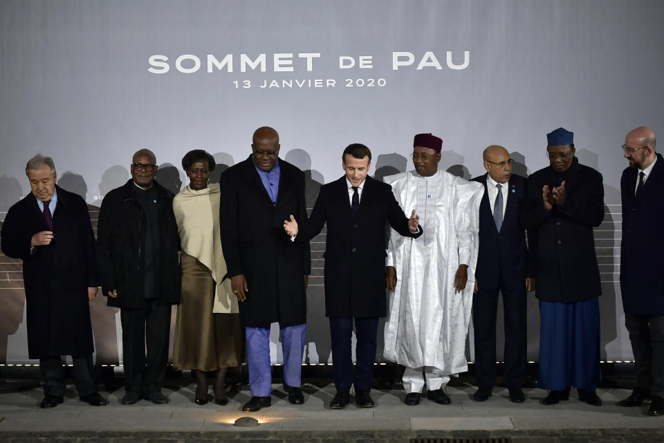 French President Emmanuel Macron, center, poses with G5 African heads of state after the G5 Sahel summit in Pau, southwestern France, Monday Jan.13, 2020. France is preparing its military to better target Islamic extremists in a West African region that has seen a surge of deadly violence. (AP Photo/Alvaro Barrientos)