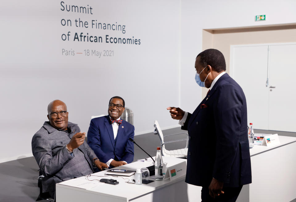 Burkina Faso's President Roch Marc Christian Kabore, left, the president of the African Development Bank Akinwumi Adesina and President of the Republic of the Congo Denis Sassou Nguesso, speak before the opening session at the Summit on the Financing of African Economies Tuesday, May 18, 2021 in Paris. More than twenty heads of state and government from Africa are holding talks in Paris with heads of international organizations on how to revive the economy of the continent, deeply impacted by the consequences of the COVID-19 pandemic. (Photo by Ludovic Marin, Pool via AP)