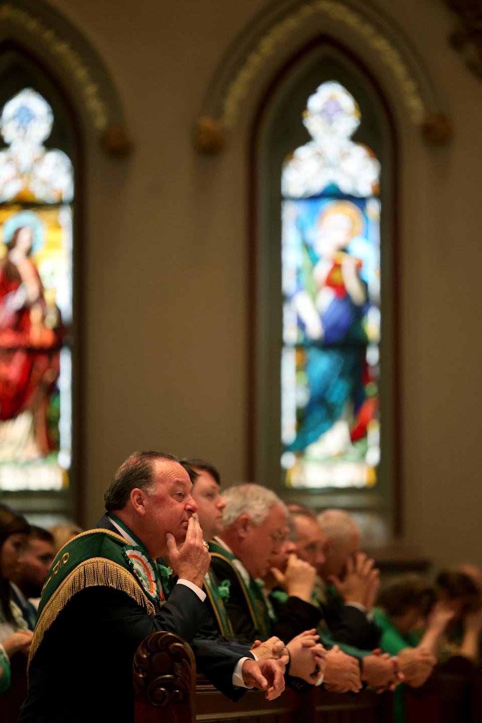 Grand Marshal John Forbes prays during the St. Patrick's Day Mass on Saturday, March 16, 2024.