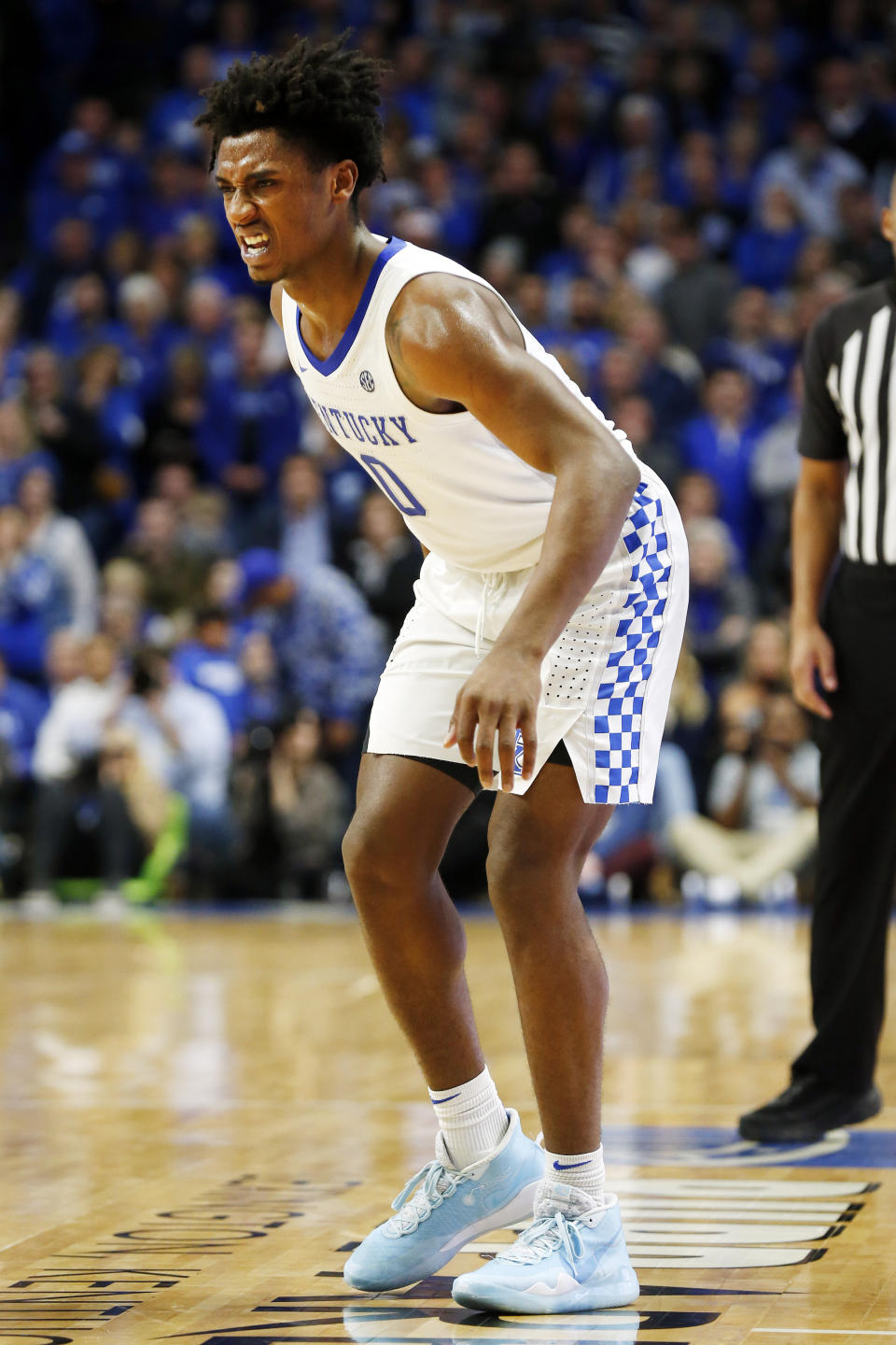 Kentucky's Ashton Hagans limps off the court with an ankle injury during the second half of an NCAA college basketball game against Missouri in Lexington, Ky., Saturday, Jan 4, 2020. Kentucky won 71-59. (AP Photo/James Crisp)