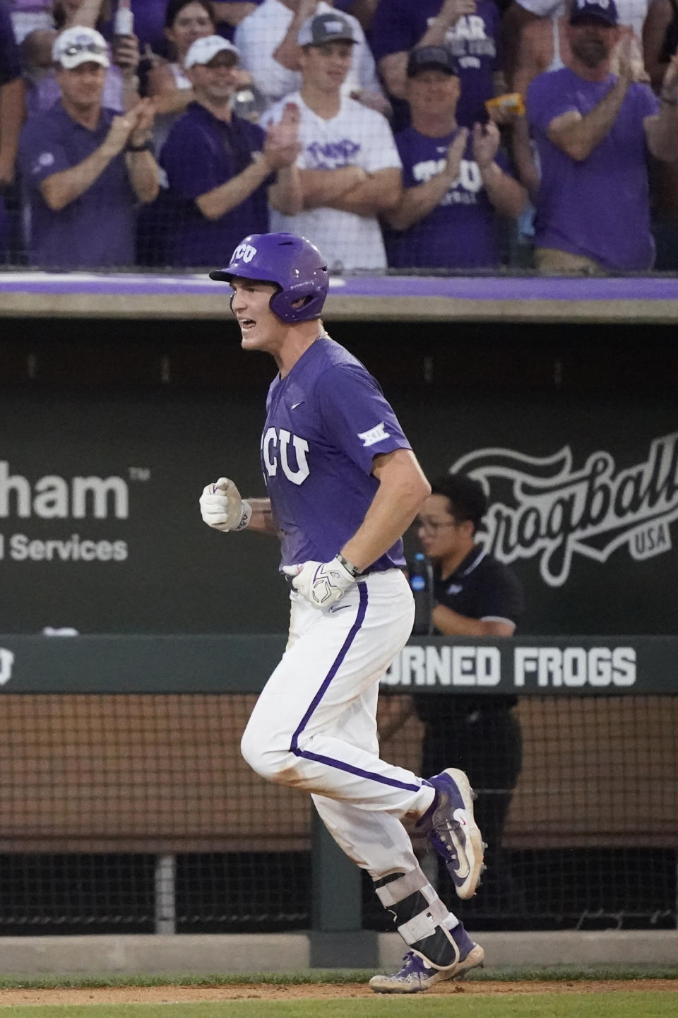 TCU's Cole Fontenelle celebrates as he runs in on his solo homer during the fifth inning of an NCAA college baseball super regional game against Indiana State in Fort Worth, Texas, Saturday, June 10, 2023. (AP Photo/LM Otero)