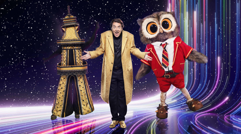 Jonathan Ross with characters on The Masked Singer