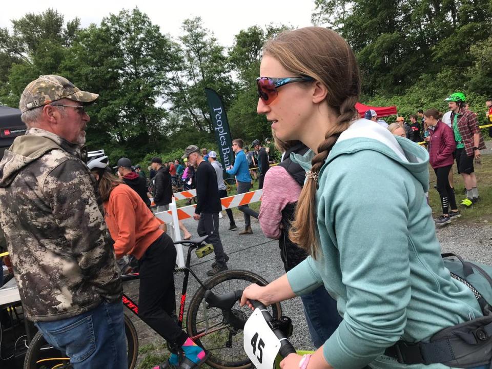 Alyssa Reetz of Are We There Yet? team heads to the pre-race cyclocross meeting at Hovander Park for the Ski to Sea race in Whatcom County, Wash., on Sunday, May 29, 2022.