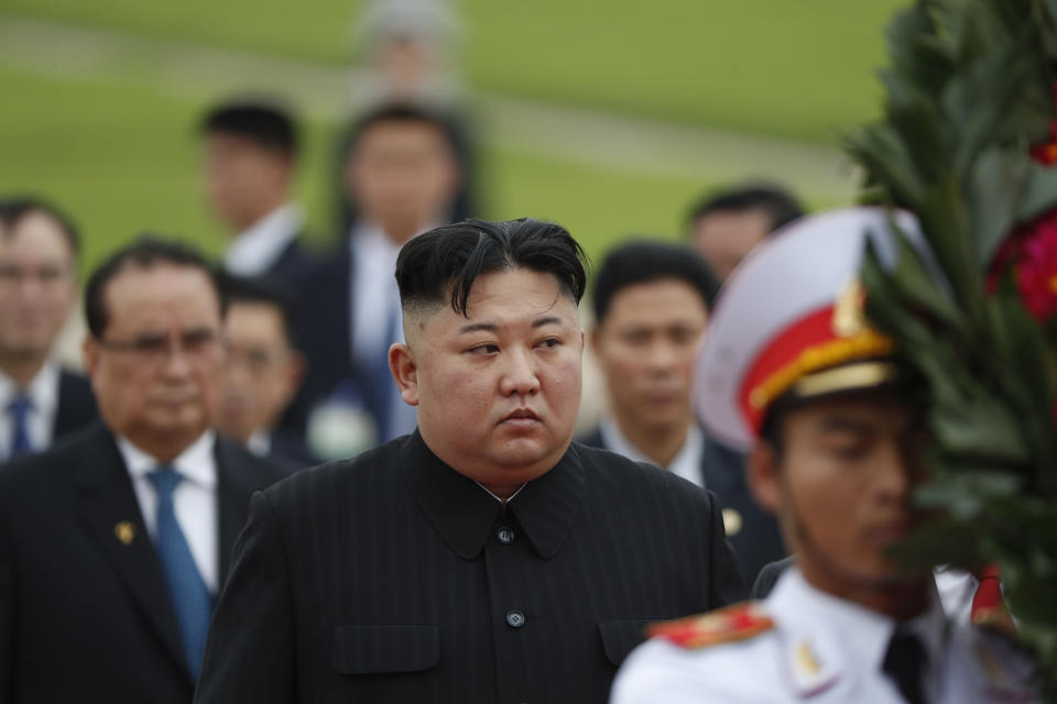 North Korean leader Kim Jong Un, center, attends a wreath laying ceremony at Ho Chi Minh Mausoleum in Hanoi, Vietnam Saturday, March 2, 2019. Kim spent his last day in Hanoi on Saturday, laying large red-and-yellow wreaths at a war memorial and at the mausoleum of national hero Ho Chi Minh as he continued an official state visit meant to cement his image as a confident world leader after his summit breakdown with President Donald Trump. (Jorge Silva/Pool Photo via AP)