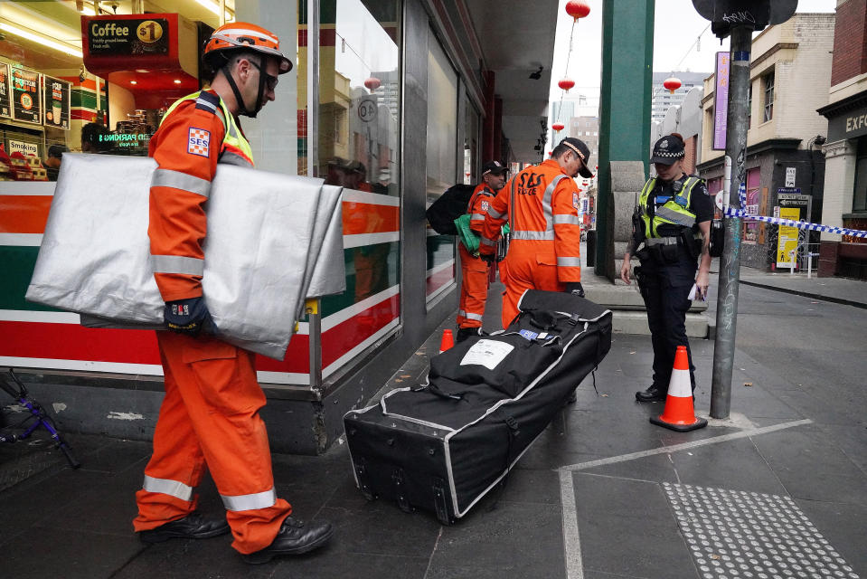 SES workers enter the scene on Little Bourke St. Source: AAP