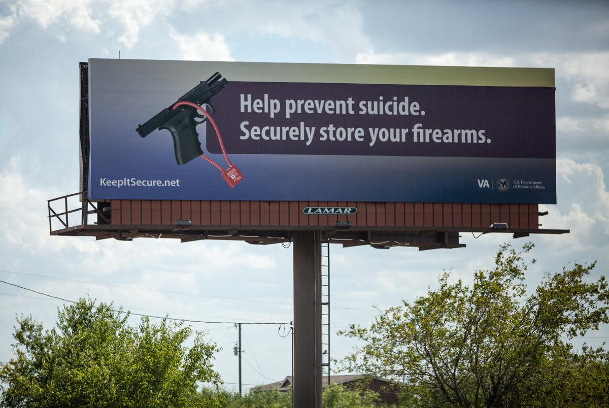 A billboard about firearm safety is displayed off Highway 130 outside Austin, TX. <cite>Credit: Pu Ying Huang/The Texas Tribune</cite>