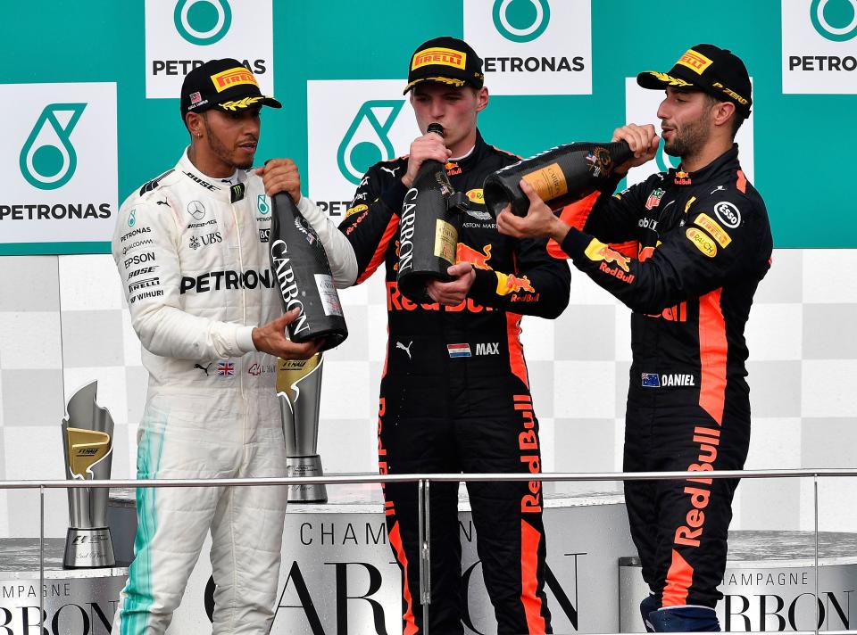 Who hired the brass section? Verstappen leads the tired trio of podium finishers in low-key celebrations after the Malaysian Grand Prix