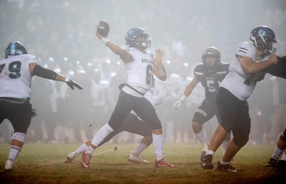 Bullard’s quarterback Roland Russo throws a first half touchdown pass in the CIF Division II Northern California Regional Championship game with Central Catholic at Central Catholic High School in Modesto, Calif., Dec. 3, 2021. Central Catholic won the game 44-41.