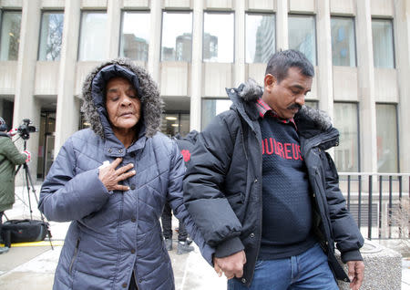 Santhanaladchumy Kanagaratnam, mother of Kirushna Kumar Kanagaratnam who was killed by Canadian serial killer Bruce McArthur, is led from court after McArthur was sentenced to life imprisonment following his guilty plea to eight counts of first-degree murder, in Toronto, Ontario, Canada, February 8, 2019. REUTERS/Chris Helgren