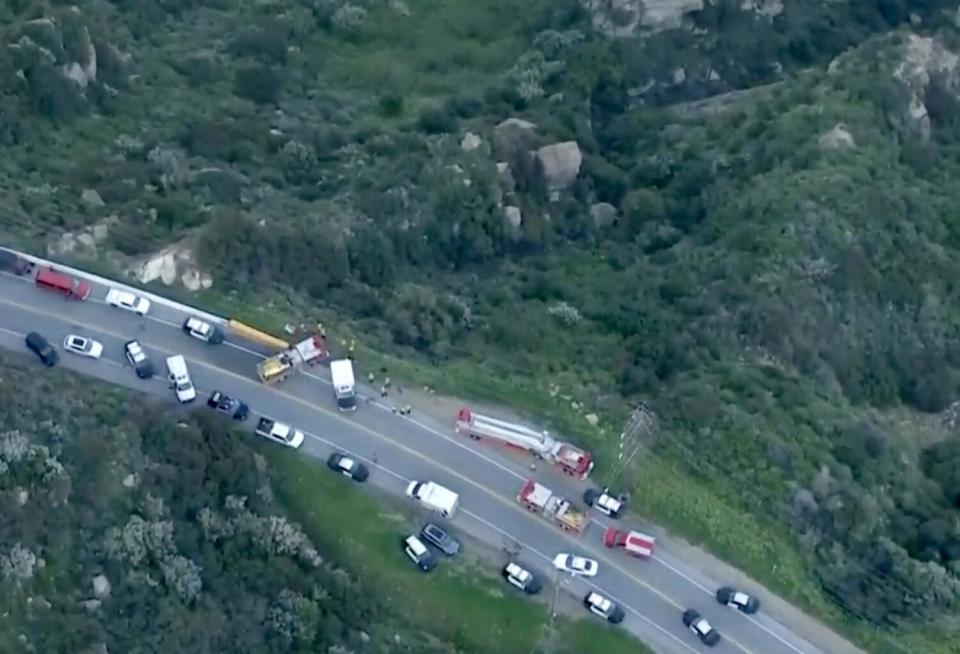 A large response by firefighters and police for a vehicle that went over the side of a canyon in Malibu