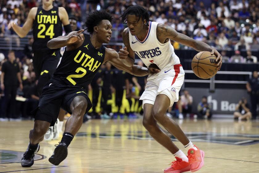 Utah Jazz's Collin Sexton (2) guards Los Angeles Clippers' Bones Hyland (5) during the third quarter.