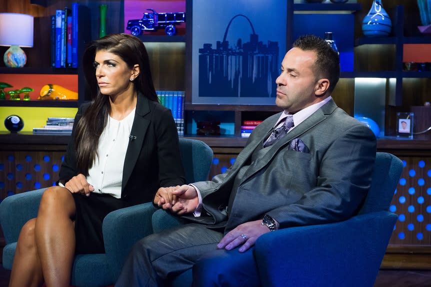 Teresa Giudice and Joe Giudice sitting solemnly at the Watch What Happens Live clubhouse in New York City.