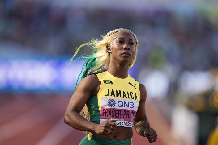 Shelly-Ann Fraser-Pryce, of Jamaica, wins the semifinal in the women's 100-meter run at the World Athletics Championships on Sunday, July 17, 2022, in Eugene, Ore. (AP Photo/Ashley Landis)