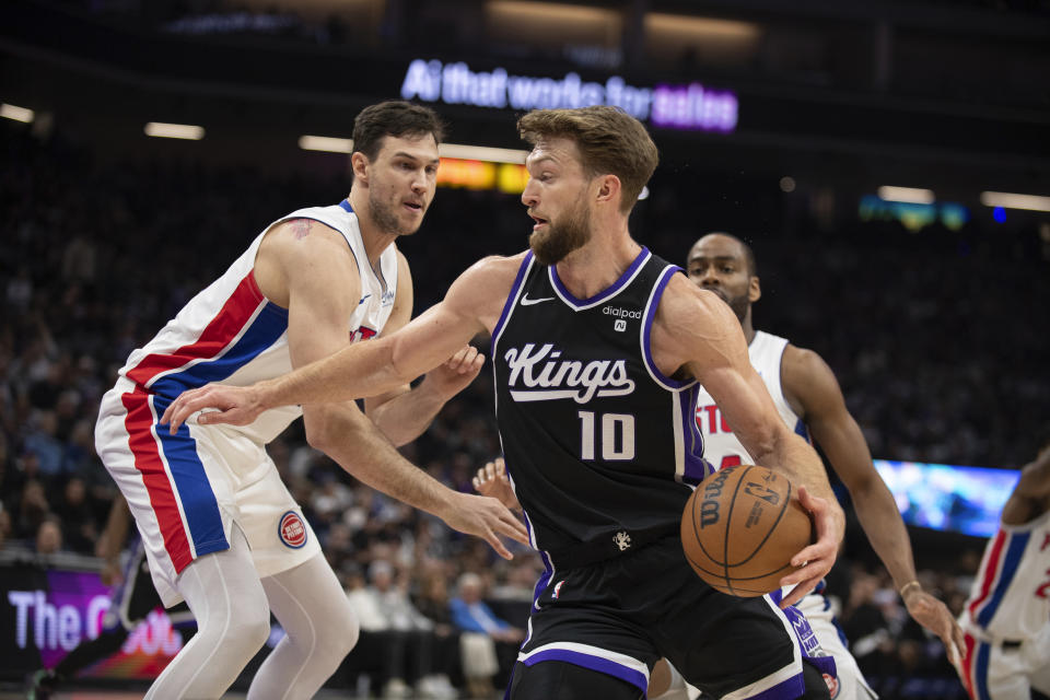 Detroit Pistons forward Danilo Gallinari defends against Sacramento Kings forward Domantas Sabonis (10) during the first half of an NBA basketball game in Sacramento, Calif., Wednesday, Feb. 7, 2024. (AP Photo/José Luis Villegas)