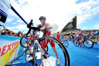 SYDNEY, AUSTRALIA - APRIL 14: In this handout photo provided by the International Triathlon Union, 2000 Sydney Olympic Games gold medallist Simon Whitfield of Canada grabs his bike in the first transition during the opening round of the 2012 ITU World Triathlon Series on April 14, 2012 in Sydney, Australia. (Photo by ITU via Getty Images)