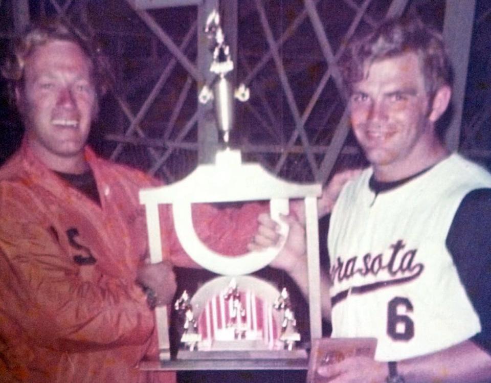 Sarasota Sailor baseball coaches Eddie Howell and Tom Whitehurst hold the 1983 state championship trophy.