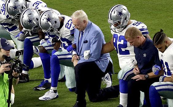 (AP) NFL players and their supporters take part in the bent knee protest