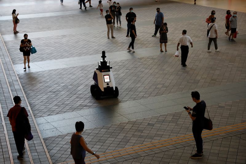 Autonomous robot Xavier patrols a neighbourhood mall to detect "undesirable social behaviours" during a three-week trial in Singapore