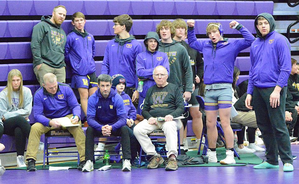 Watertown High School coaches and wrestlers look on during the Marv Sherrill Duals wrestling tournament on Saturday, Dec. 3, 2022 in the Civic Arena.