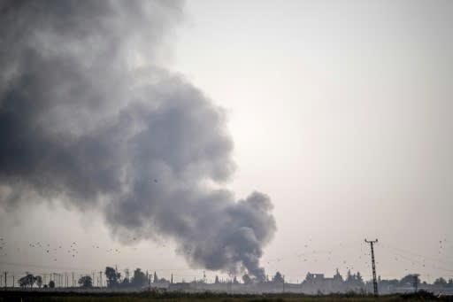 Smoke rises from the Syrian town of Tal Abyad after Turkish bombings