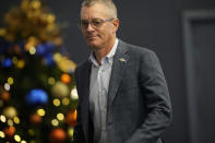 Denver Broncos chief executive officer Greg Penner heads into a news conference about the firing of head coach Nathaniel Hackett Tuesday, Dec. 27, 2022, in Englewood, Colo. (AP Photo/David Zalubowski)