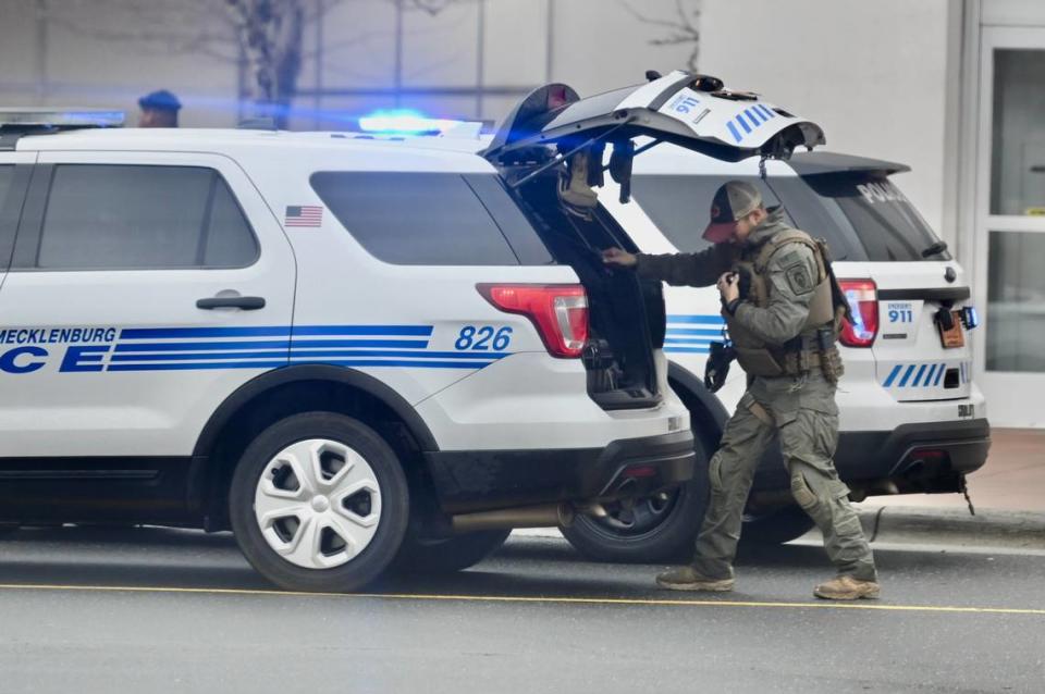 A Charlotte-Mecklenburg police officer prepares to enter Northlake Mall following a shooting on Dec. 15, 2022.