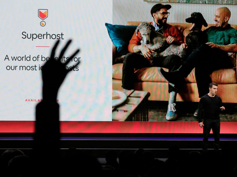 Airbnb co-founder and CEO Brian Chesky speaks about the revamped Superhost program as Superhosts raise their hands during the keynote at the Masonic theater in San Francisco