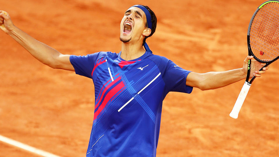 Lorenzo Sonego is pictured celebrating after winning a record-breaking tie breaker at the French Open.