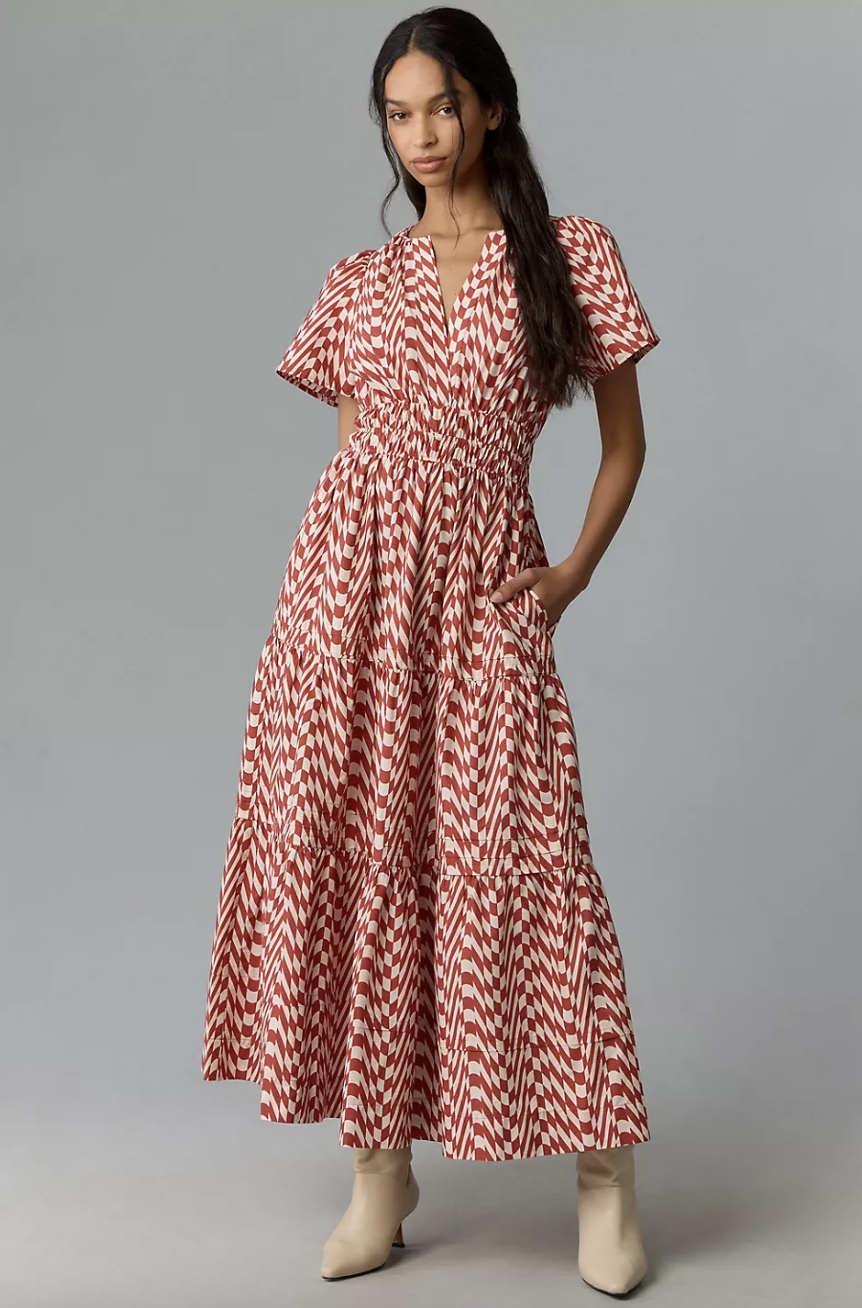 model in white boots and red and white patterned, The Somerset Maxi Dress in rose (photo via Anthropologie)