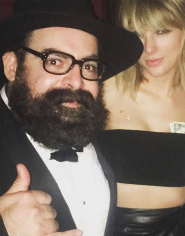 Taylor Swift poses for a snap with cash stuffed down her boob tube at Drake's birthday bash. Source: Instagram/@YoungBeardo