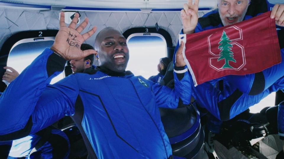 Jaison Robinson and Victor Vescovo experiencing weightlessness. - Credit: Courtesy Blue Origin