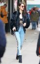 <p>In a fur bomber, black track jacket, lace bodysuit, Sandro embellished jeans, black ankle boots and red tinted sunglasses after her Ralph Lauren fitting in New York City.</p>