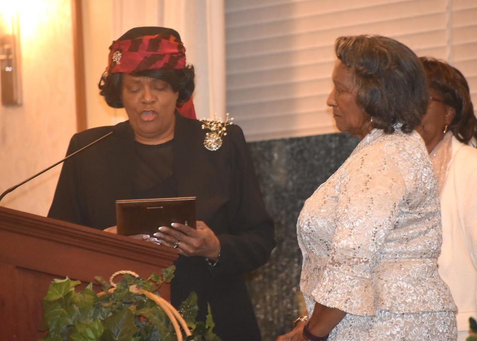 Andre'a Benard, left, past president of the Lenawee County Martin Luther King,. Jr. committee and an Adrian resident, presents the 2023 Lifetime Community Achievement Award to the Rev. Deanne Henagan, right, during the annual Martin Luther King Jr. Community Celebration and Dinner Monday, Jan. 16, 2023.