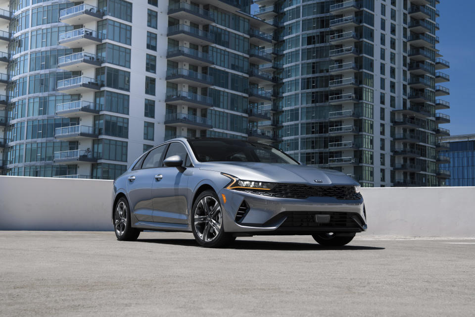 This photo provided by Kia Motors America shows the 2021 Kia K5. The K5, Edmunds' top-rated midsize sedan, offers all-wheel drive on both the LXS and GT-Line trim levels. (Robin Trajano/Kia Motors America via AP)