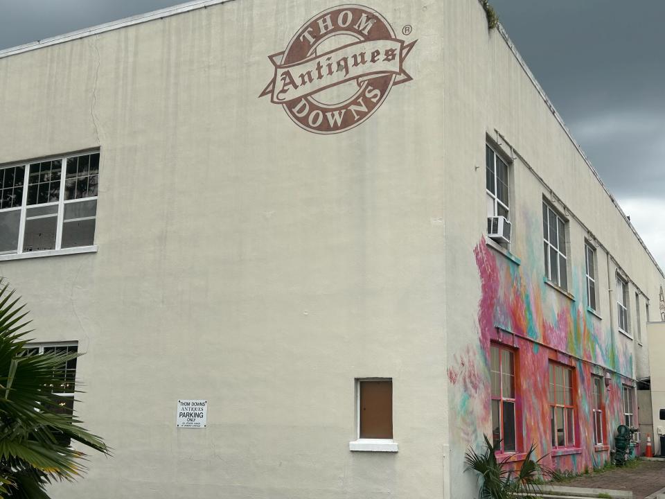 The Thom Downs Antiques building was purchased by Thomas William Downs in 1985 for $195,000. The mural on the side was painted in in 2018 by Gabriela Jaxson.