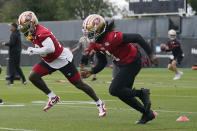 San Francisco 49ers wide receivers Deebo Samuel, left, and Brandon Aiyuk take part in an NFL football practice in Santa Clara, Calif., Tuesday, June 6, 2023. (AP Photo/Jeff Chiu)