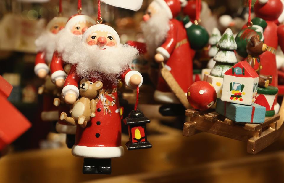 BERLIN, GERMANY - NOVEMBER 26: Christmas decorations hang for sale at the Kaethe Wohlfahrt stand at the annual Christmas market at Gendarmenmarkt on its opening day on November 26, 2012 in Berlin, Germany. Christmas markets, with their stalls selling mulled wine, Christmas tree decorations and other delights, are an integral part of German Christmas tradition, and many of them opened across Germany today. (Photo by Sean Gallup/Getty Images)