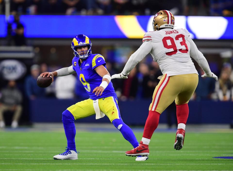 Rams quarterback Matthew Stafford is pressured by 49ers defensive tackle D.J. Jones during Sunday's game.